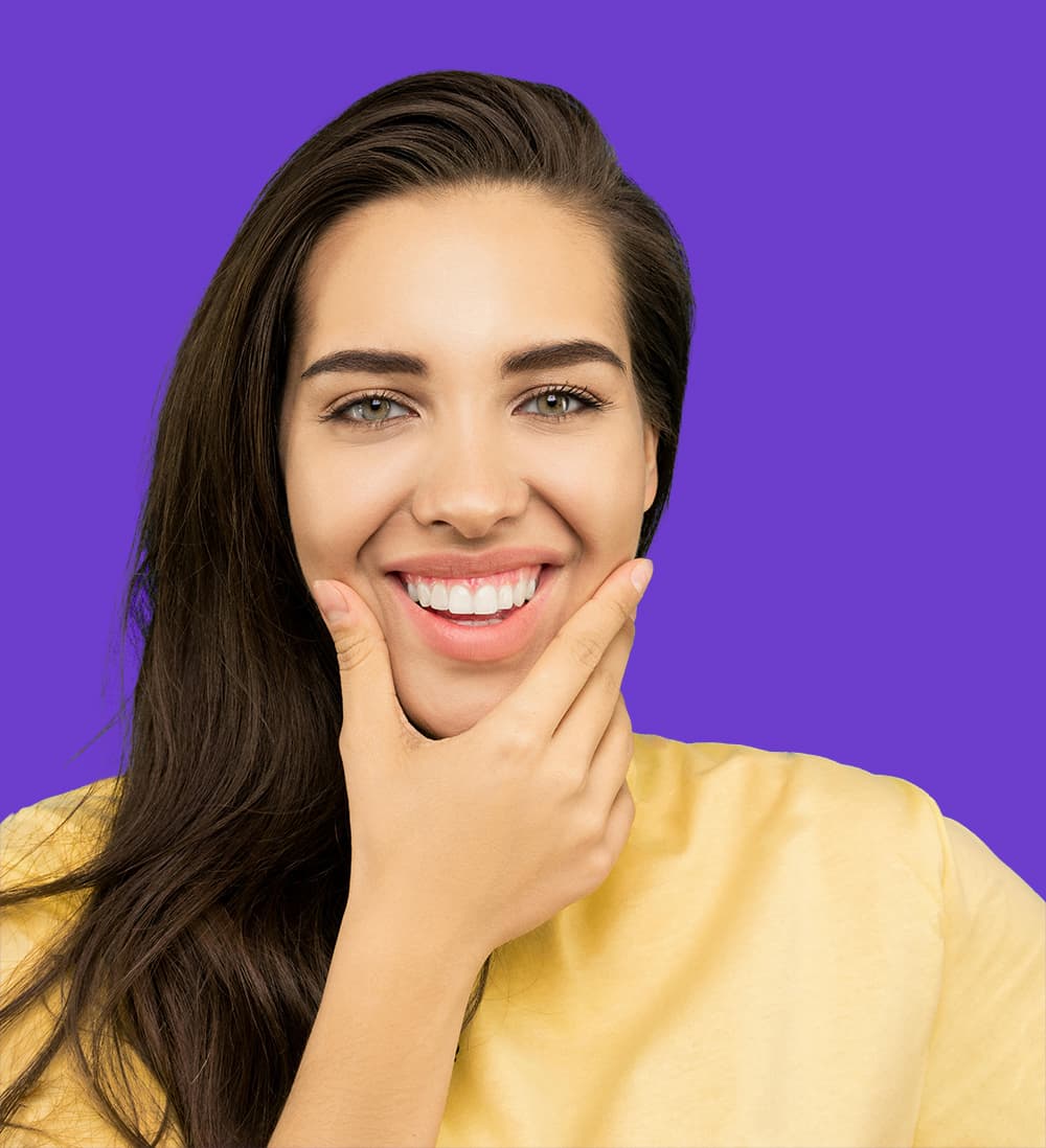 Sonrisa saludable y brillante de una paciente de Ole Dental